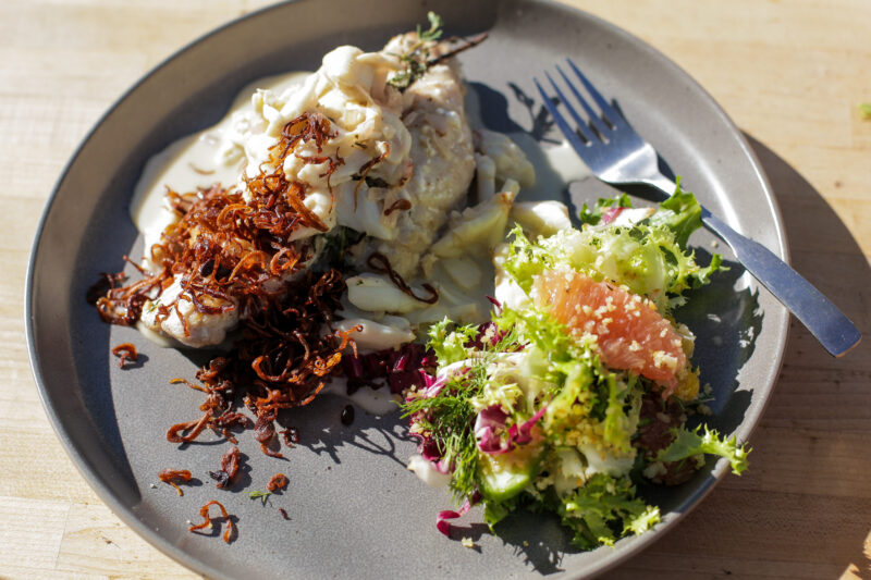 Andrew Zimmern grills sheepshead with crab butter sauce on Field to Fire.