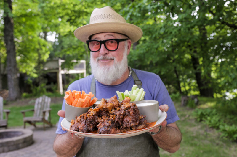 Andrew Zimmern with buffalo squab