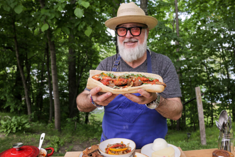 Andrew Zimmern with fried beef sandwiches