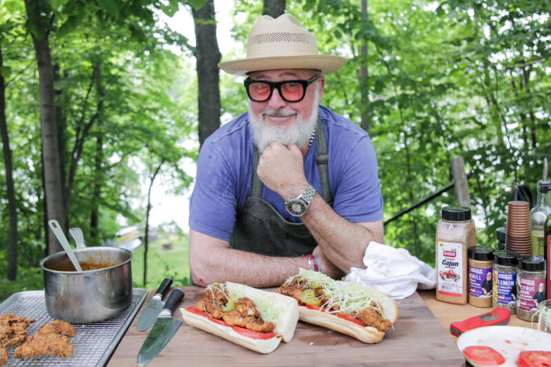 Andrew Zimmern with po'boys