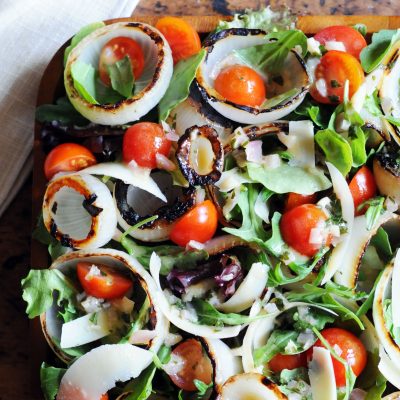 Andrew Zimmern' Grilled Onion Salad with Arugula