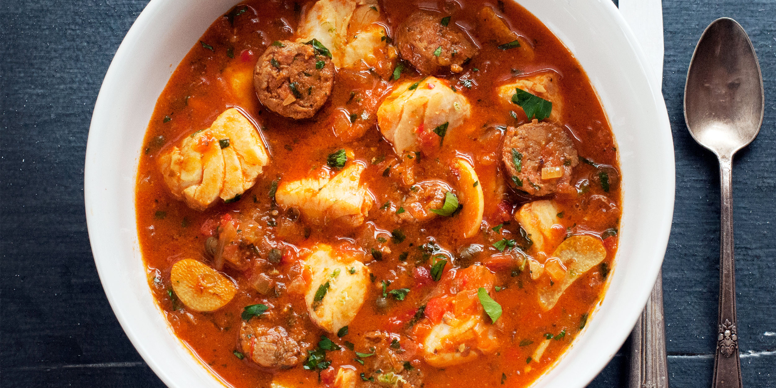 Braised Striped Bass with Andouille Sausage Andrew Zimmern