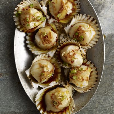 Scallop in its shell (or spoon) with jamón ibérico fat and soy-sherry-ginger vinaigrette|