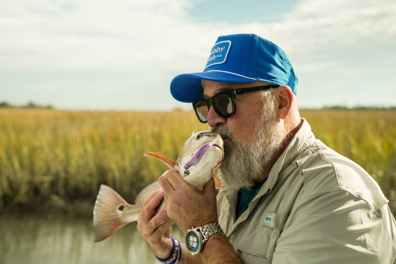 Andrew Zimmern fishes for redfish on Field to Fire.