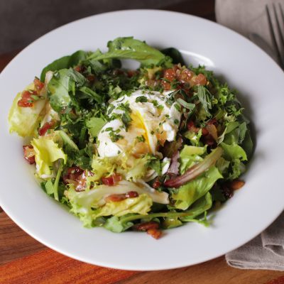 Andrew Zimmern's recipe for salad with poached eggs and bacon vinaigrette
