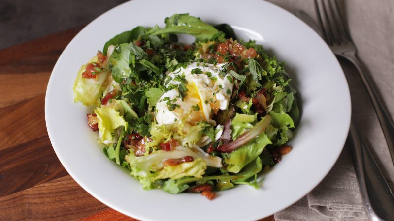 Andrew Zimmern's recipe for salad with poached eggs and bacon vinaigrette