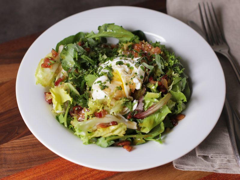 Andrew Zimmern's recipe for salad with poached eggs and bacon vinaigrette