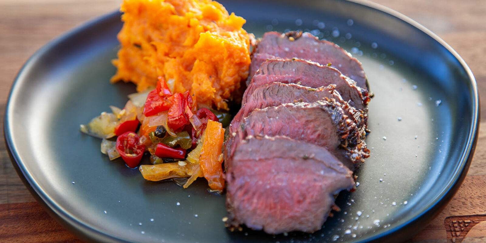 Pan Seared Venison With Coal Roasted Sweet Potatoes And Pepper Relish