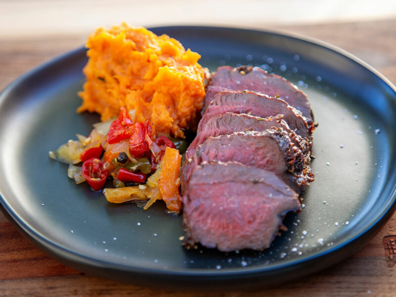 Pan-Seared Venison with Coal Roasted Sweet Potatoes and Pepper Relish Recipe