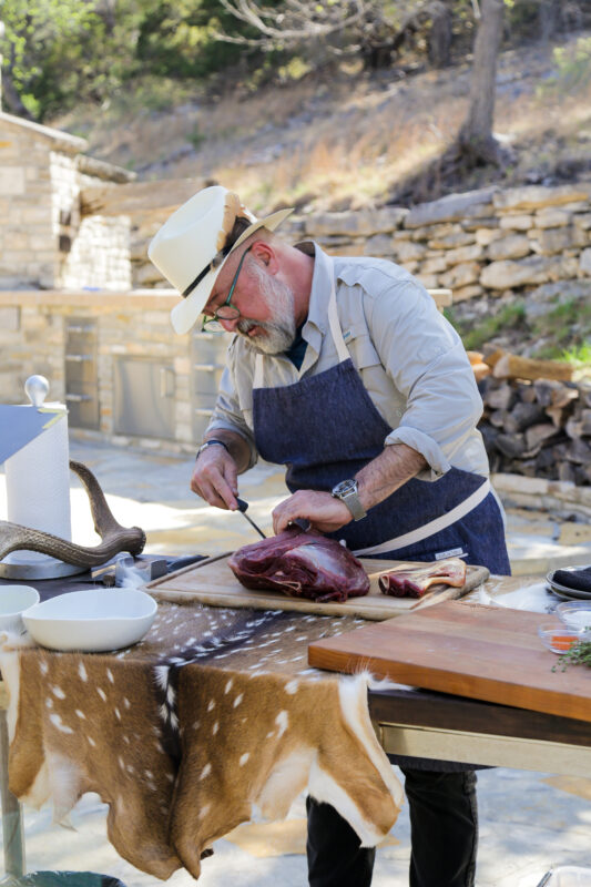 Andrew Zimmern butchers an axis deer leg on Wild Game Kitchen